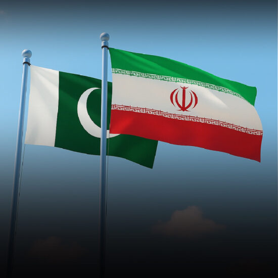 Pakistani and Iranian flags at a border crossing, with pilgrims and support facilities