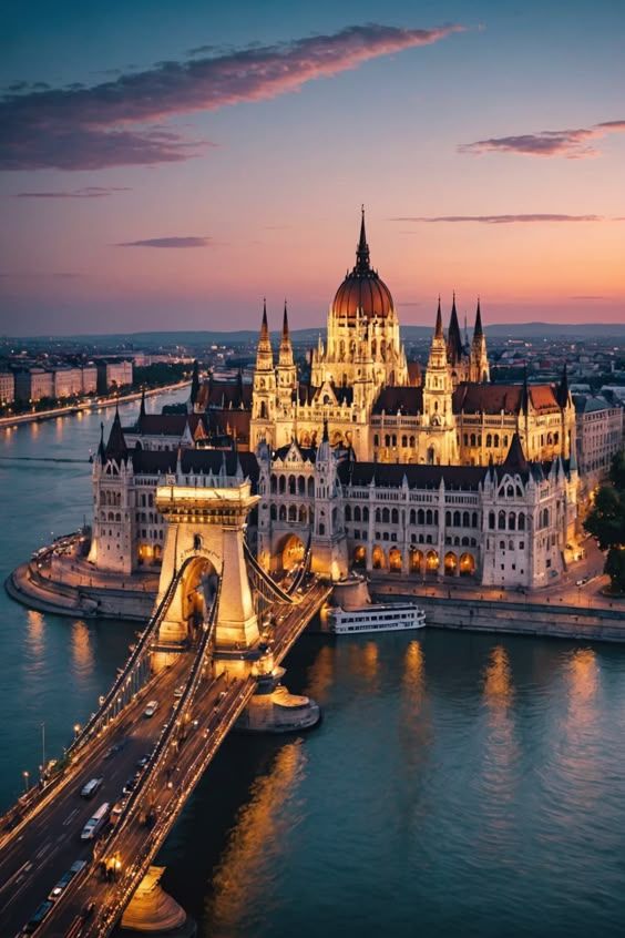 Sunset over a European city with historic buildings and a river, representing Golden Visa property investment opportunities.