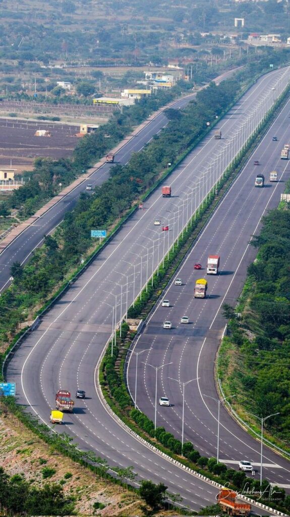 Lahore–Raiwind Motorway with vehicles in motion, green belts, and city skyline, illustrating Punjab’s modern infrastructure.