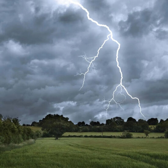 Lightning and storm clouds over a Pakistani landscape, signaling flood and landslide risk