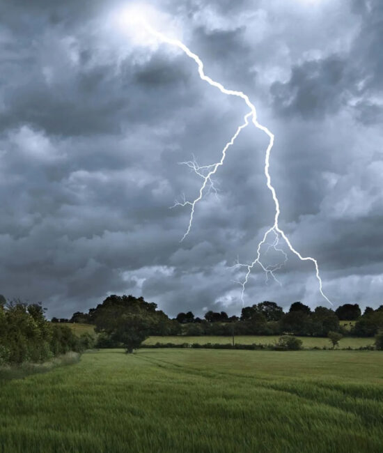 Lightning and storm clouds over a Pakistani landscape, signaling flood and landslide risk