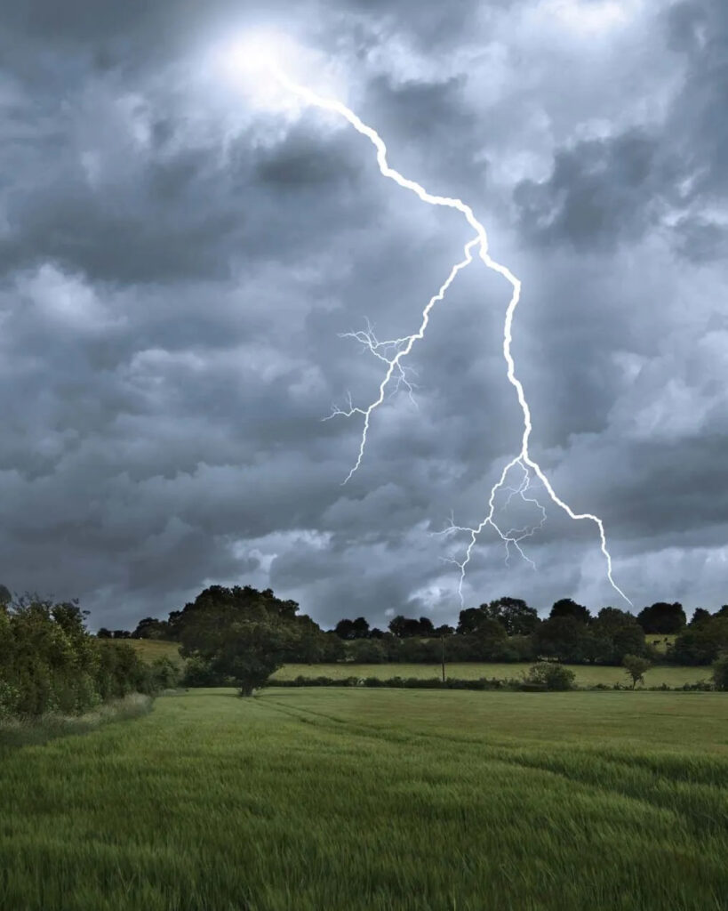 Lightning and storm clouds over a Pakistani landscape, signaling flood and landslide risk