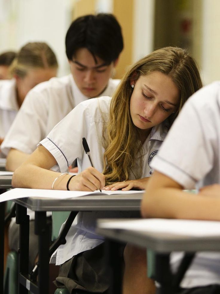 Pakistani students in uniform studying together, representing readiness for the new matric and inter grading system.