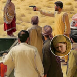 A woman in traditional Balochi attire stands alone in the desert, with imposing shadows of tribal men and a blurred gavel symbolizing the tension between custom and justice.