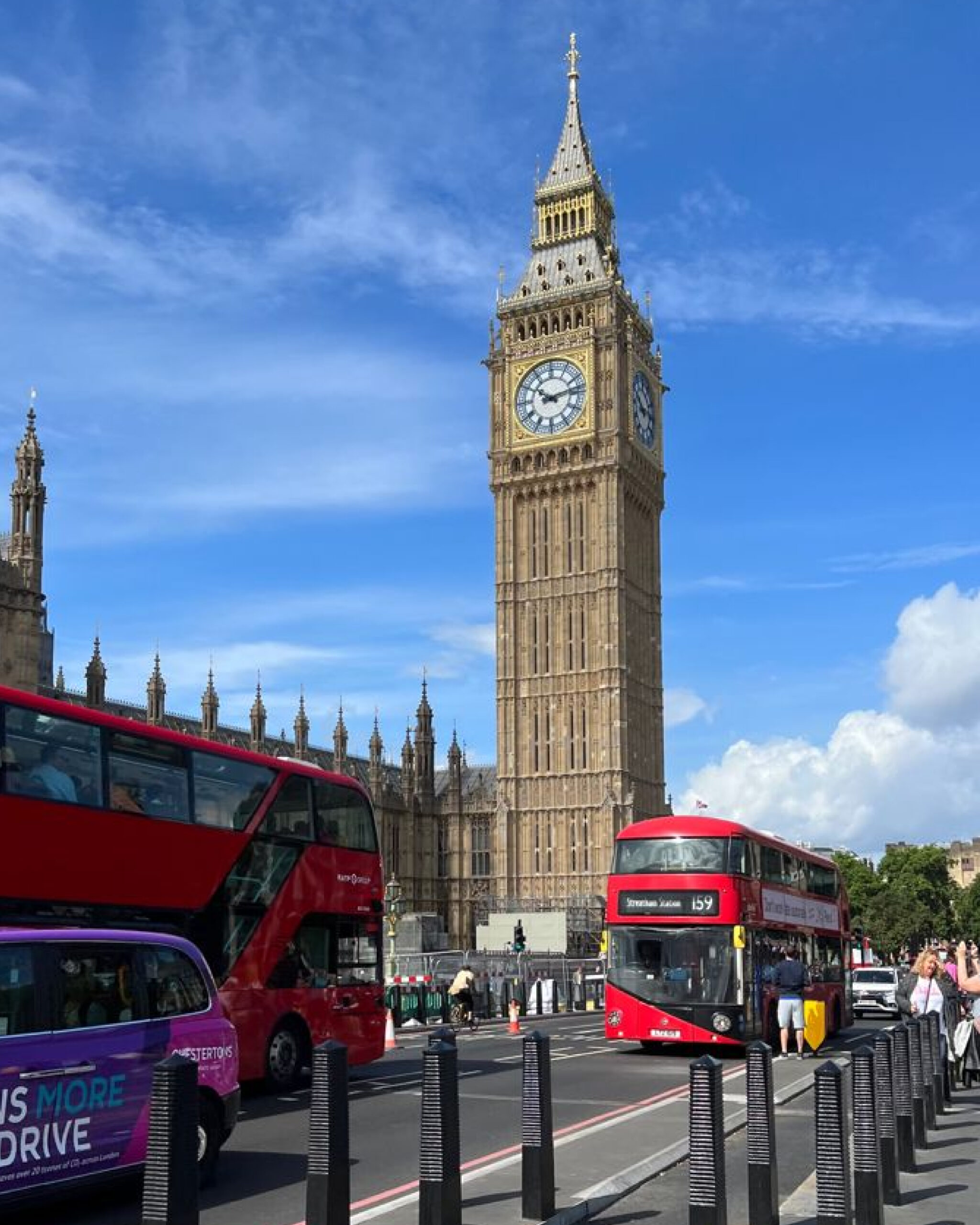 Professional with UK visa documents in front of Big Ben, representing successful Global Talent Visa application.