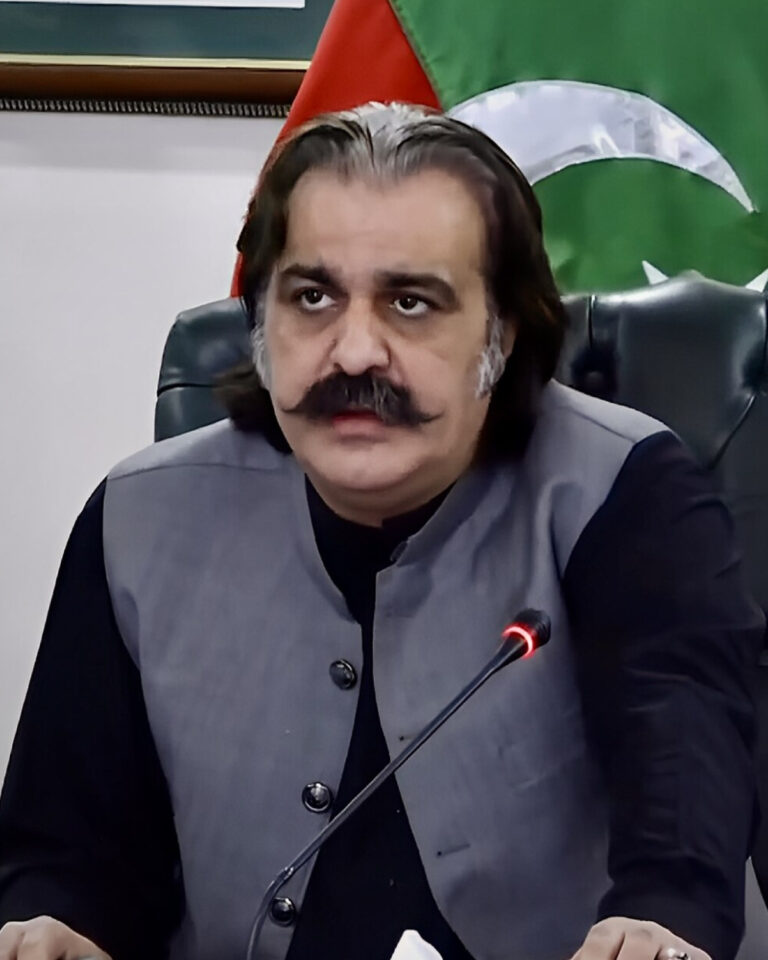 Pakistani citizens reacting with concern while watching news about the KPK biscuit spending scandal, with social media posts visible in the background.